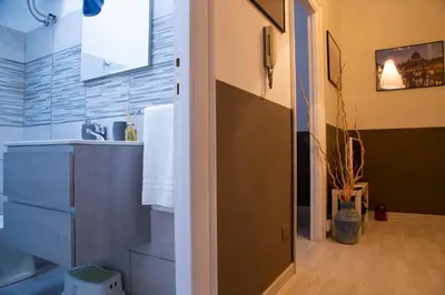 a bathroom with a sink and a counter top at San Silverio Luxury House in Rome