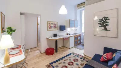 a small apartment with a kitchen and a living room at Rental in Rome Pompeo Magno in Rome