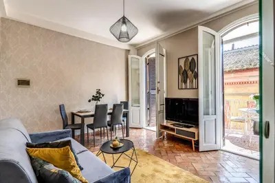 a living room with a couch and a table at Maison Babuino in Rome