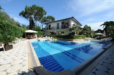 a large swimming pool in front of a house at Casa di Alberta in Rome