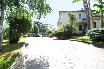 an empty road in front of a house at Casa di Alberta in Rome