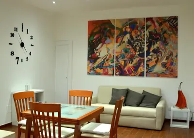 a living room with a couch and a table at Casa di Alberta in Rome