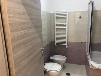 a bathroom with a toilet and a sink at Rita a Trastevere in Rome