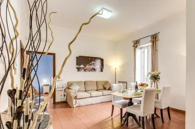 a living room with a table and a couch at Finally in Rome in Rome