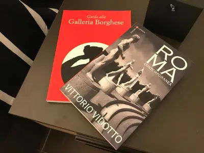 two books sitting on top of a table at Appartamento in via Licia in Rome