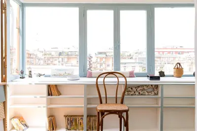 a desk with a chair in front of a window at Rome Top floor with Terrace in Rome