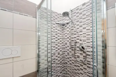 a shower in a bathroom with a glass door at Vaticano terrace: brand new 2 bedrooms 2 bathrooms in Rome