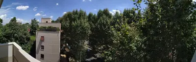 a view of a building with trees in front of it at GARBATELLA'S in ROME in Rome