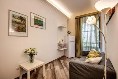a living room with a couch and a table at Dimore Vespasiano in Rome