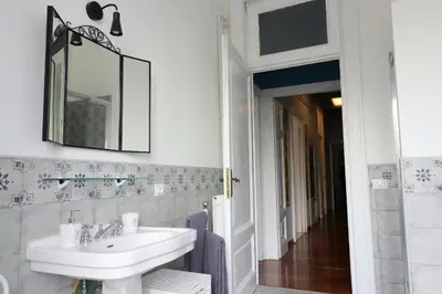 a bathroom with a sink and a mirror at Trevi Grand Blu Suite B&B in Rome