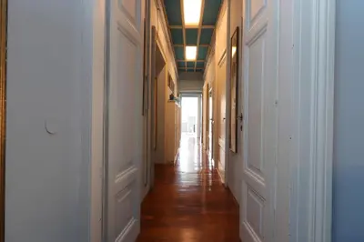 a hallway with white walls and wooden floors at Trevi Grand Blu Suite B&B in Rome