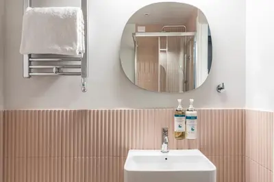 a shower with a glass door in a bathroom at Numa Rome Linea in Rome
