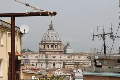 a view of a building with a cathedral at Saint Peter s roof in Rome