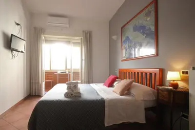 a bedroom with a bed with a teddy bear on it at Holiday flat in central location in Rome in Rome
