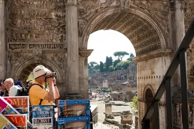 a man taking a picture of a building with a camera at Holiday flat in central location in Rome in Rome