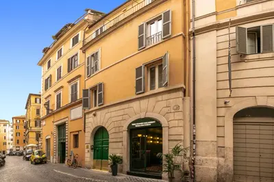 a building on a street in a city at Tree Charme Parliament Boutique Hotel in Rome