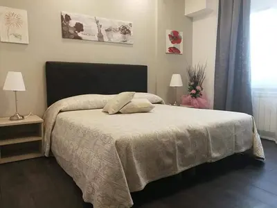 a bedroom with a bed with two pillows on it at Da Angelica in Rome