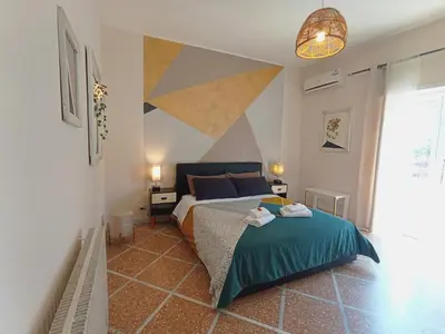 a bedroom with a bed with a green blanket at Bed and Breakfast Zoe holiday in Rome