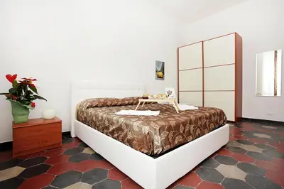 a bedroom with a large bed with a table on it at Angels In Rome in Rome