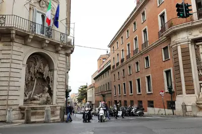 a group of motorcycles parked next to a building at Trevi Suite B&B in Rome