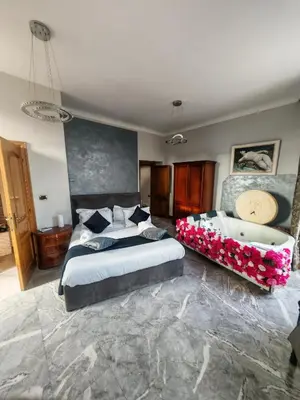 a bedroom with two beds and a bath tub at View Colosseo From Jacuzzi in Rome