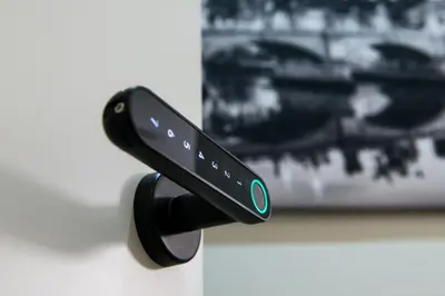 a remote control hanging on a wall next to a picture at St. Peter Manor in Rome