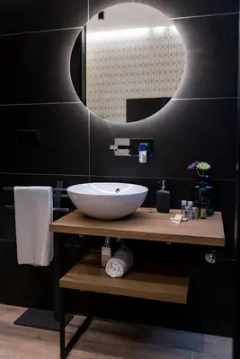 a bathroom with a sink and a mirror at St. Peter Manor in Rome