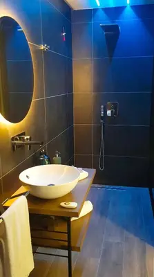 a bathroom with a white sink and a mirror at St. Peter Manor in Rome