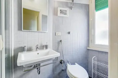 a bathroom with a sink and a toilet at BDC - King Termini Apartment in Rome