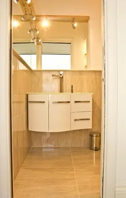 a bathroom with a sink and a mirror at Glamroom Vatican Apartment in Rome