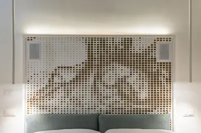 a room with a couch in front of a window at Numa Roma Guesthouse in Rome