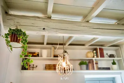 a chandelier hanging from a ceiling in a room at Boutique Apartment Roma in Trastevere in Rome