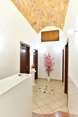 a kitchen with white walls and a ceiling at B&B Rome Terminal House in Rome