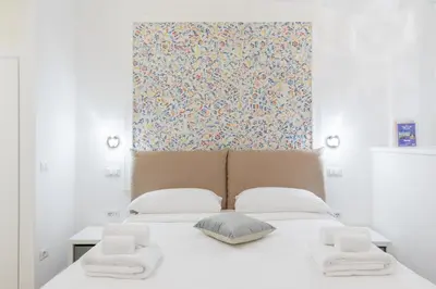 a bedroom with a bed with two towels on it at Dolce Vita New Studio in Rome