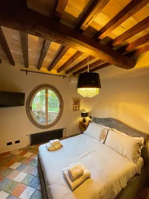 a bedroom with a large white bed with a window at Domus Luxury Gianicolo in Rome