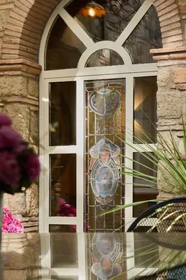 a door with a stained glass window on a house at Domus Luxury Gianicolo in Rome
