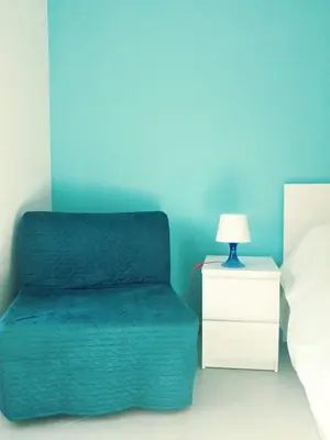 a bedroom with a bed and a nightstand with a lamp at Roma TouristHome via palestro 56 in Rome