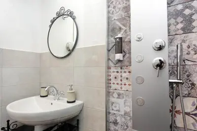 a bathroom with a sink and a mirror at Domus Ponte Milvio in Rome