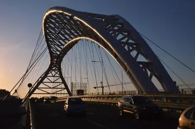 a bridge with cars driving on a highway at Casa Italiano - BestBnB Garbatella in Rome