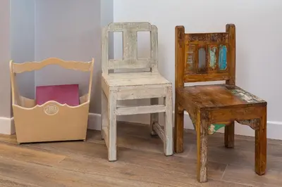 a group of different types of chairs and a box at Many Days Apartments in Rome