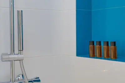 a kitchen counter with a sink and a blue cabinet at Many Days Apartments in Rome