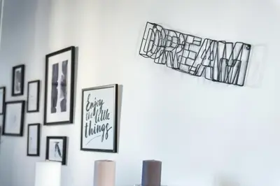 a group of framed pictures on a wall at Cozy studio Campo de Fiori in Rome