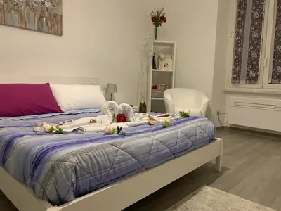 a bedroom with a bed with flowers on it at La Casa di Emanuela in Rome