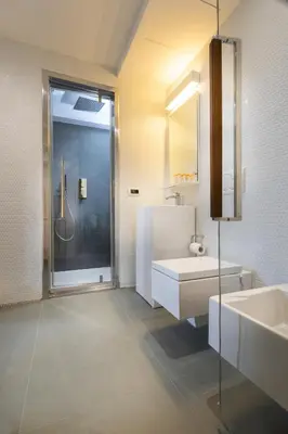 a bathroom with a shower and a sink and a mirror at Navona Stay in Rome