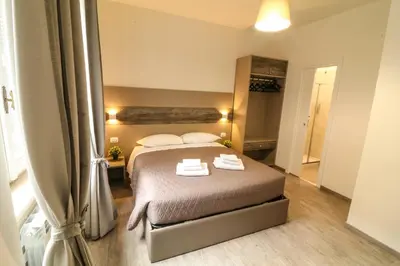 a bedroom with a bed with two towels on it at BorgoNove in Rome