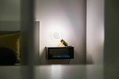 a lamp with a mirror on top of a tv at Vasari's Home in Rome