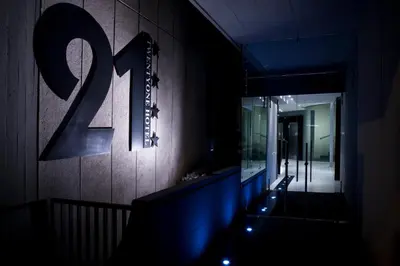 a hallway with the number on the wall at Twentyone Hotel in Rome