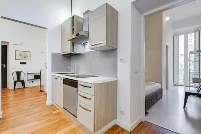 a kitchen with a sink and a counter top at BMGA l Central Holiday House 2Bdr near Vatican in Rome