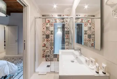 a bathroom with a sink and a shower at Dolcevita Apartments in Rome