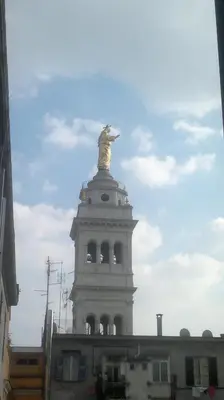 a statue on the top of a building at Hotel Stadler 2 in Rome